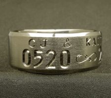 Titanium wedding ring 2 line beveled edge with a fishhook infinity dash