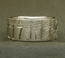 This 2 line 10mm titanium elk ring was designed around an image of the elk that hangs out in the clients front yard