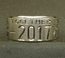 This 2 line 10mm titanium elk ring was designed around an image of the elk that hangs out in the clients front yard