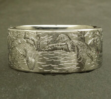 A committed pair of locked up mallards in a forest lake on a 2 line duck band