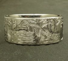 A committed pair of locked up mallards in a forest lake on a 2 line duck band