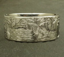 A committed pair of locked up mallards in a forest lake on a 2 line duck band