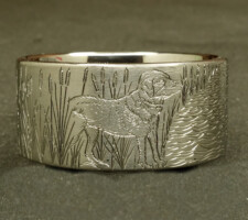 A ring depicting a dog and duck
