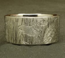 A ring depicting a dog and duck