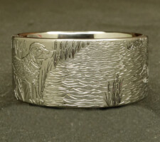 A ring depicting a dog and duck