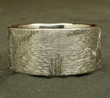 A ring depicting a dog and duck