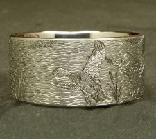A ring depicting a dog and duck
