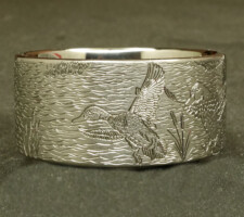 A ring depicting a dog and duck