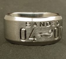 Beveled edge 2 line duck band with double mallard feather dash and a wood duck bust on the back side