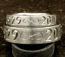 Single line date only with fishhook infinity dash and crossed rifle and fishing pole matching pair wedding rings