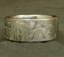 Two line titanium duck ring with committed pair of mallards and cattails. With a crossed shotgun and fishing pole with family initials