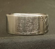 Titanium Deer ring with the buck and doe in a winter setting