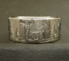 Titanium Deer ring with the buck and doe in a winter setting