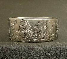 Titanium Deer ring with the buck and doe in a winter setting