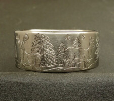 Titanium Deer ring with the buck and doe in a winter setting