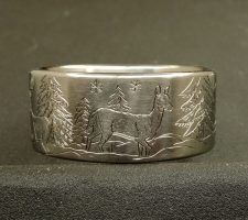 Titanium Deer ring with the buck and doe in a winter setting