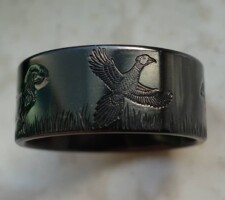 Inlayed gold turtle with a black zirconium band